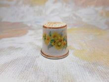 Charger l'image dans la galerie, A child's porcelain thimble with yellow flowers. c1860