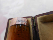 Load image into Gallery viewer, A boxed amber cheroot holder. 9ct gold band. Edwardian.