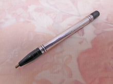 Laden Sie das Bild in den Galerie-Viewer, A silver / black lacquer propelling pencil. HM 1923.