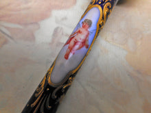 Load image into Gallery viewer, A Continental porcelain parasol handle painted with cherubs. c1880