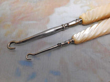 Load image into Gallery viewer, A pair of mother of pearl handled button hooks.  c1900-1920.