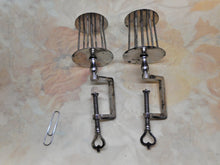 Laden Sie das Bild in den Galerie-Viewer, A pair of steel cage winding clamps. c1820-1830