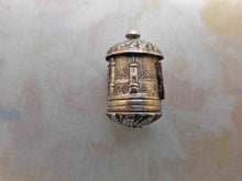 Load image into Gallery viewer, An embossed silver tape measure with a view of Abbotsford. c 1840
