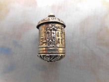 Load image into Gallery viewer, An embossed silver tape measure with a view of Abbotsford. c 1840