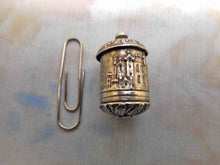 Load image into Gallery viewer, An embossed silver tape measure with a view of Abbotsford. c 1840