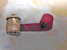 Load image into Gallery viewer, An embossed silver tape measure with a view of Abbotsford. c 1840