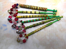 Load image into Gallery viewer, A group of 6 dyed and decorated mutton bone lace bobbins. 19thc