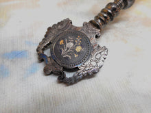 Load image into Gallery viewer, A cut steel hemming clamp with netting post and reel holder. Dated 1857.