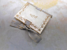 Load image into Gallery viewer, SOLD……An engraved mother of pearl needle case in the form of a book. c 1850
