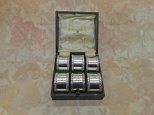 Load image into Gallery viewer, A set of 6 Mappin & Webb silver plated napkin rings. c1900