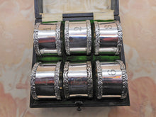 Load image into Gallery viewer, A set of 6 Mappin & Webb silver plated napkin rings. c1900
