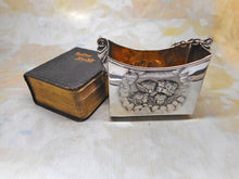 Load image into Gallery viewer, A silver prayer book holder with its prayer book. HM. 1903