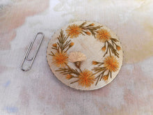 Load image into Gallery viewer, A pale blue silk pin cushion disc with embroidery. c 1830