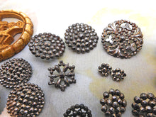 Load image into Gallery viewer, A mixed lot of steel studded buttons plus a Deco design.