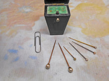 Load image into Gallery viewer, A small leather case fitted with pearl topped lace pins. 19thc