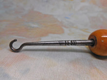 Load image into Gallery viewer, A Mauchline Ware button hook. c1890. Bamborough / Bambrugh Castle.