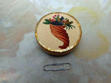 Laden Sie das Bild in den Galerie-Viewer, A Georgian painted card pin cushion disc. c1800