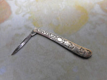 Load image into Gallery viewer, An engraved silver folding seam cutter. c1860