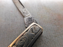 Load image into Gallery viewer, An engraved silver folding seam cutter. c1860