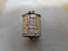 Laden Sie das Bild in den Galerie-Viewer, A silver tape measure depicting Windsor Castle. c1850.