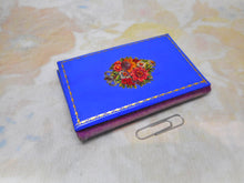 Laden Sie das Bild in den Galerie-Viewer, A blue needle book with Kirby's needle packets inside. c1880