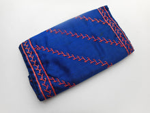 Load image into Gallery viewer, An embroidered blue silk wallet dated 1892.