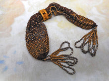 Load image into Gallery viewer, A 19th century ‘miser's purse’ with gilt metal beading.
