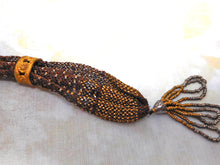 Load image into Gallery viewer, A 19th century ‘miser's purse’ with gilt metal beading.
