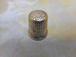 A small English silver thimble by Charles Horner. Chester 1924.