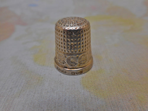 A small English silver thimble by Charles Horner. Chester 1924.