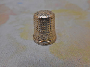 A small English silver thimble by Charles Horner. Chester 1924.