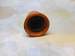 A thimble carved from a corozo palm tree nut. c1850