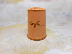 A blush ivory Worcester porcelain thimble painted with a redstart. c1870.