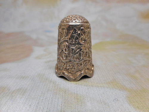 An Indian silver thimble in a leather case. c1880