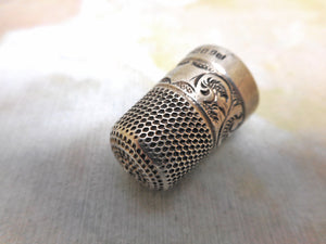 A decorative silver thimble.  Birmingham 1905
