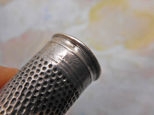 A dome topped Continental silver thimble. 19thc