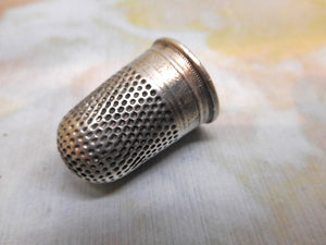 A dome topped Continental silver thimble. 19thc