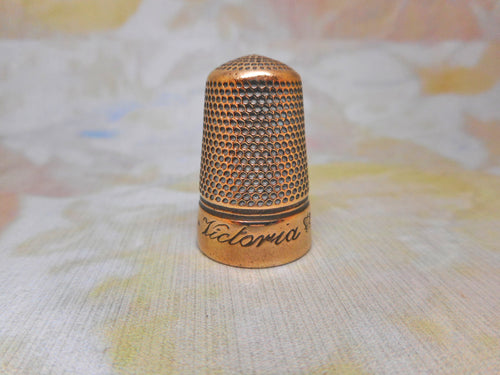 'Victoria Jubilee' base metal brass alloy thimble. Iles design c1888.