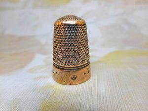 'Victoria Jubilee' base metal brass alloy thimble. Iles design c1888.