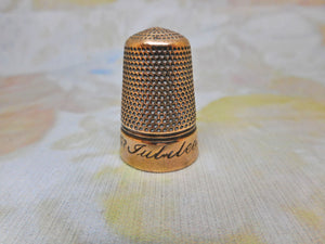 'Victoria Jubilee' base metal brass alloy thimble. Iles design c1888.