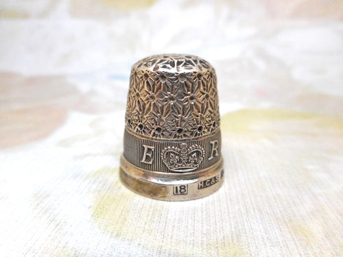 Queen Elizabeth's coronation souvenir thimble. HM  1952.