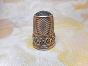 A Continental decorative silver thimble with stone top. c 1870