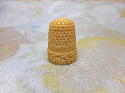 A thimble made from a tagua palm tree nut. c1850
