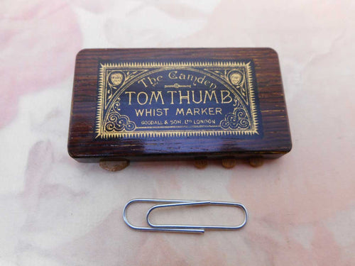 A 'Tom Thumb' whist marker. Goodall & Son London.