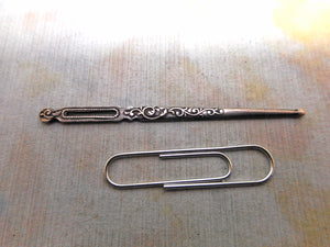 A French silver bodkin / ribbon threader. c1870.
