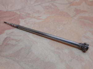 A French silver propelling pencil. c1880