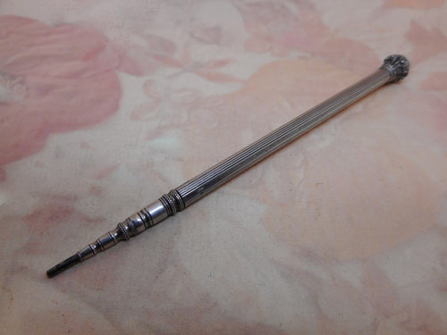 A French silver propelling pencil. c1880