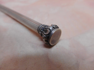 A French silver propelling pencil. c1880