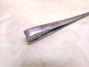 A steel earspoon and tweezer combination piece. Rodgers cutler.