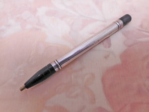 A silver / black lacquer propelling pencil. HM 1923.